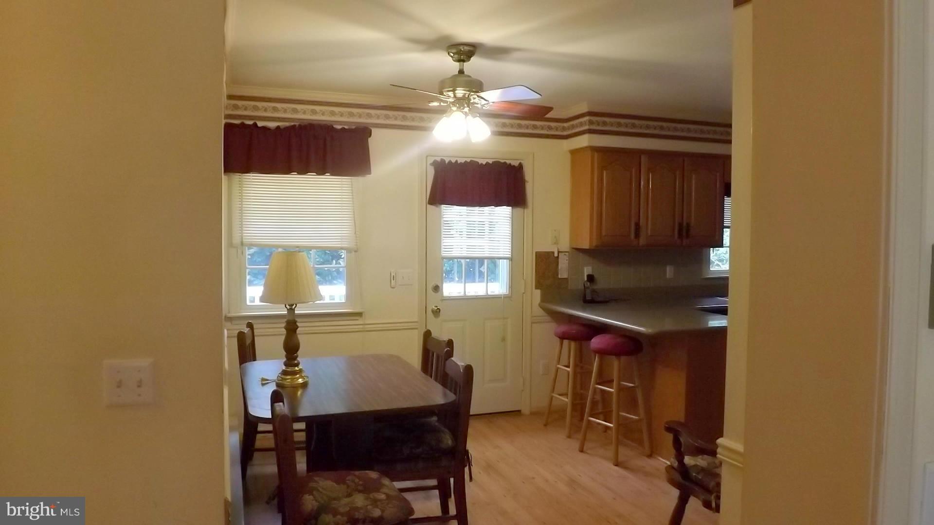 103 Douglas Ln Street St. Michaels, MD 21663 - Photo 7 of 28 a kitchen with a sink cabinets and window