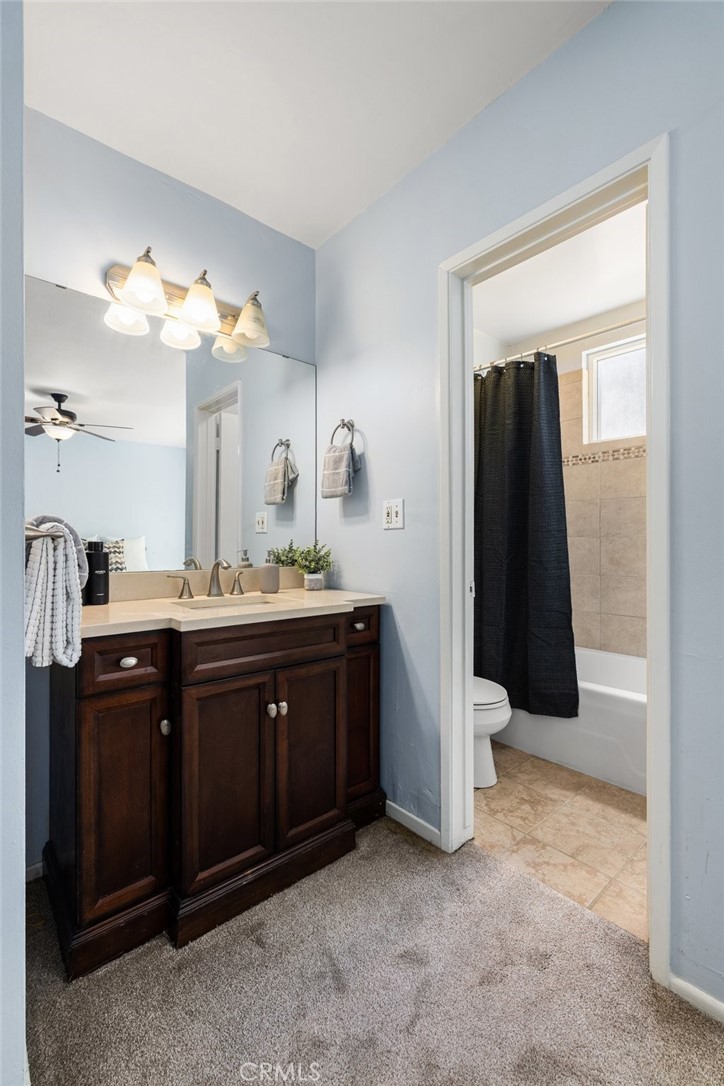 360 Gladys Avenue, Unit 2 Long Beach, CA 90814 - Photo 15 of 22 a bathroom with a double vanity sink and mirror