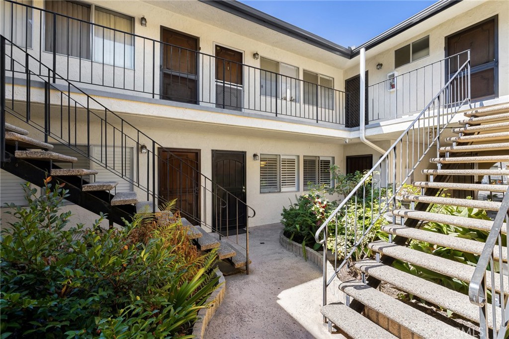 360 Gladys Avenue, Unit 2 Long Beach, CA 90814 - Photo 21 of 22 a front view of a house with a garden