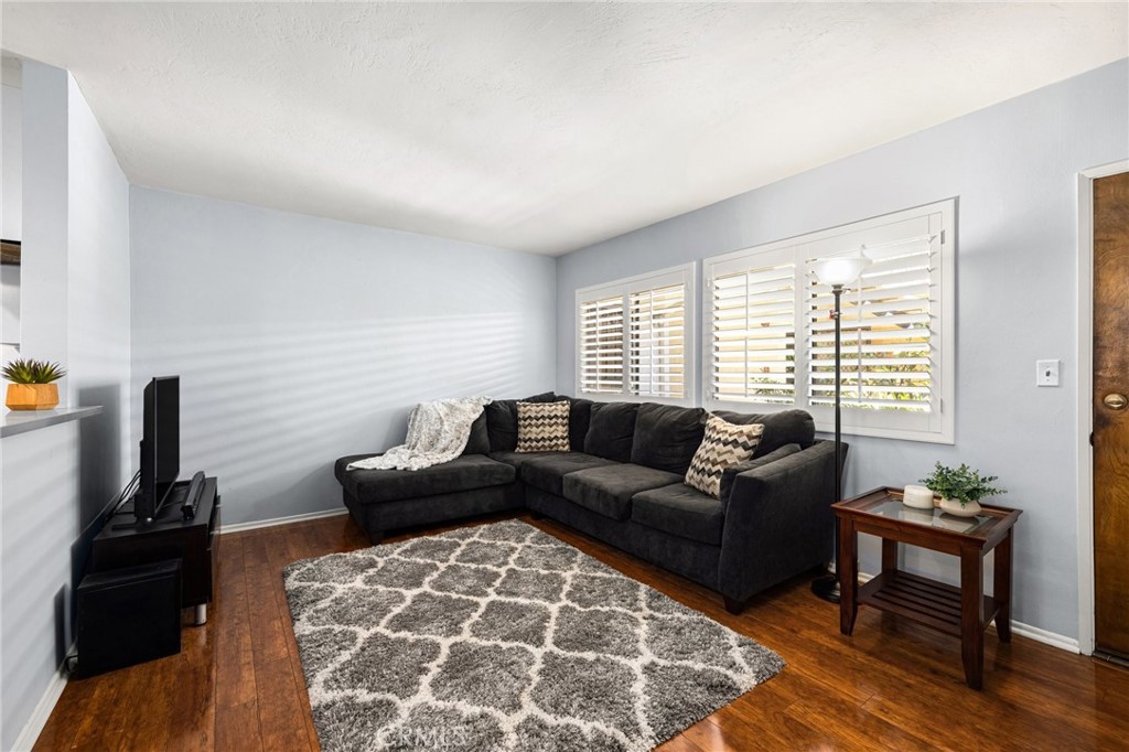 360 Gladys Avenue, Unit 2 Long Beach, CA 90814 - Photo 3 of 22 a living room with furniture and a flat screen tv