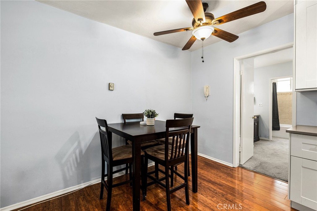 360 Gladys Avenue, Unit 2 Long Beach, CA 90814 - Photo 5 of 22 a view of a dining room with furniture and wooden floor