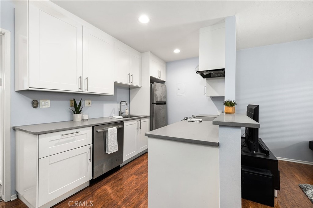 360 Gladys Avenue, Unit 2 Long Beach, CA 90814 - Photo 6 of 22 a kitchen with stainless steel appliances a sink stove and refrigerator