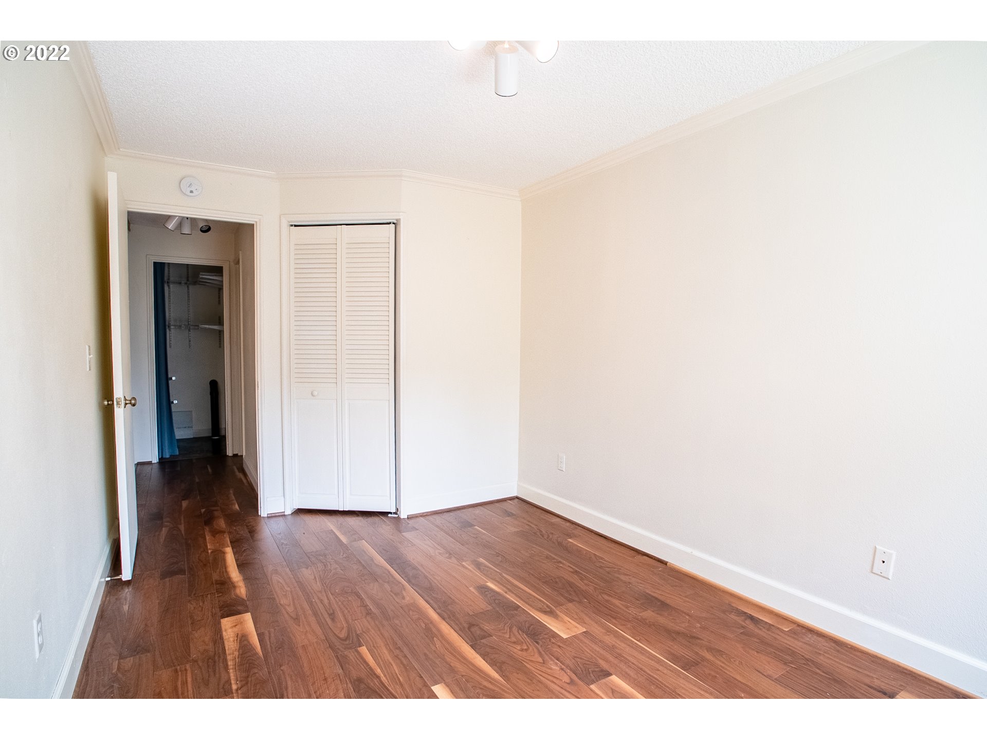 1727 Northeast Multnomah Street, Unit 2 Portland, OR 97232 - Photo 8 of 10 a view of an empty room with wooden floor