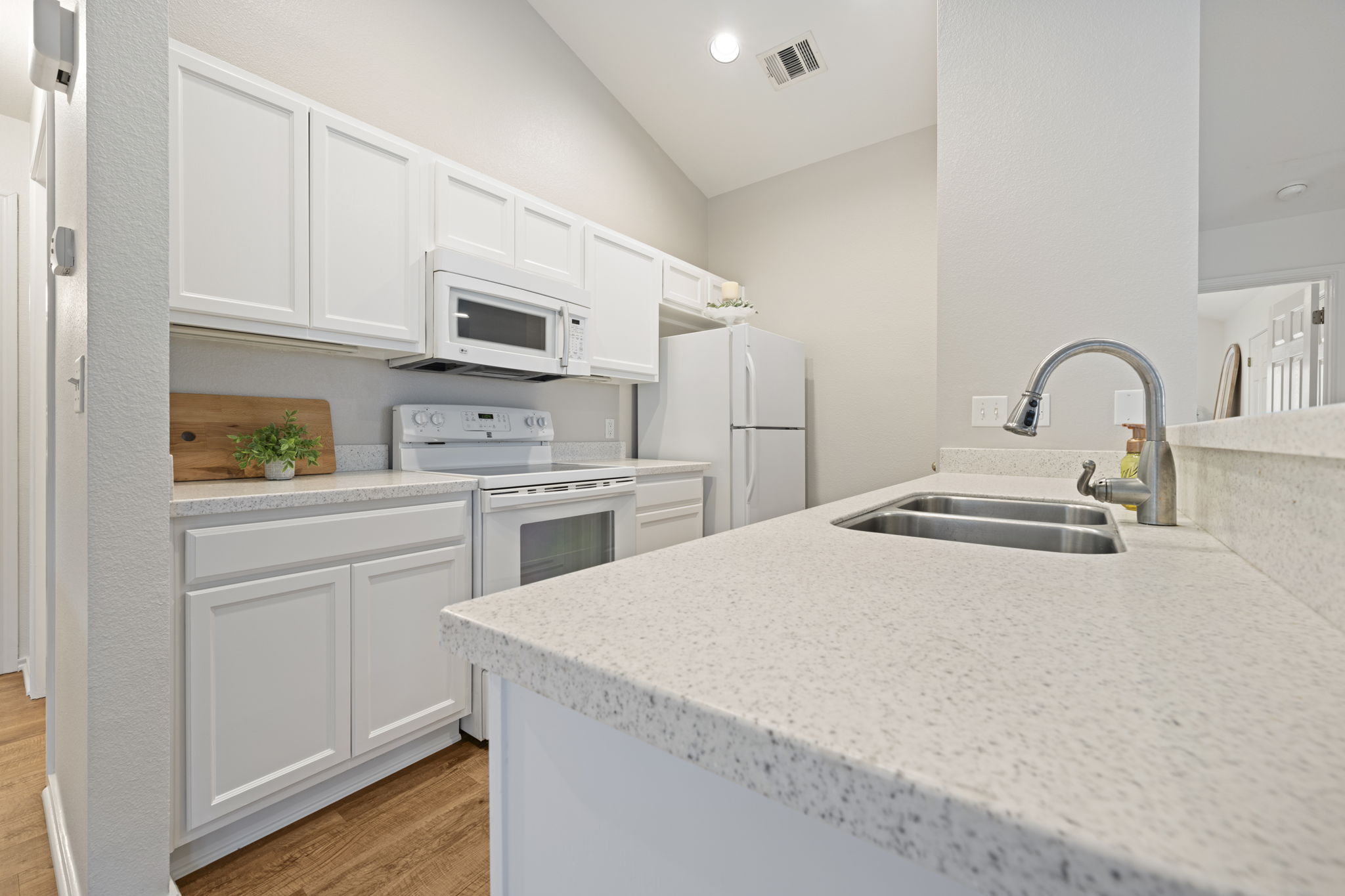 1011 Janae Court Georgetown, TX 78626 - Photo 14 of 26 a kitchen with a sink a stove and cabinets
