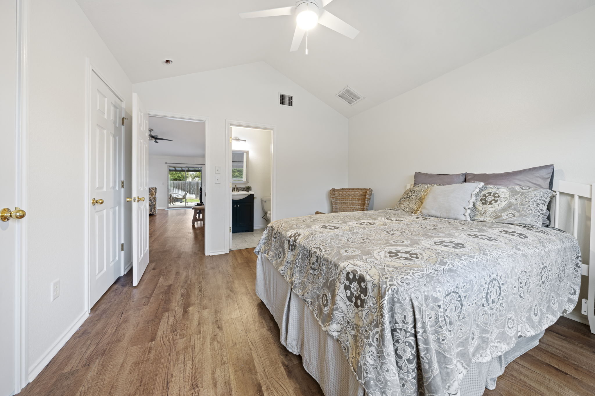 1011 Janae Court Georgetown, TX 78626 - Photo 16 of 26 a bedroom with a bed and a chandelier
