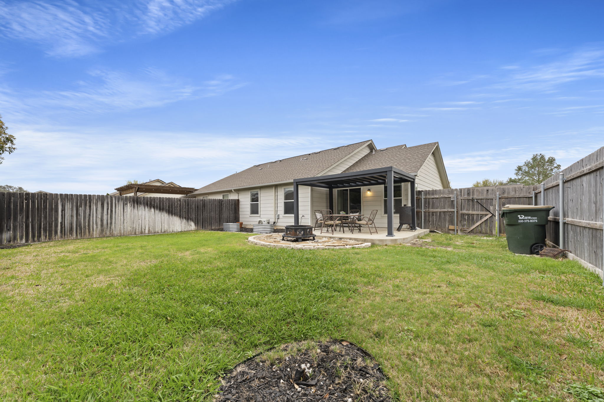 1011 Janae Court Georgetown, TX 78626 - Photo 19 of 26 a front view of a house with backyard porch and outdoor seating