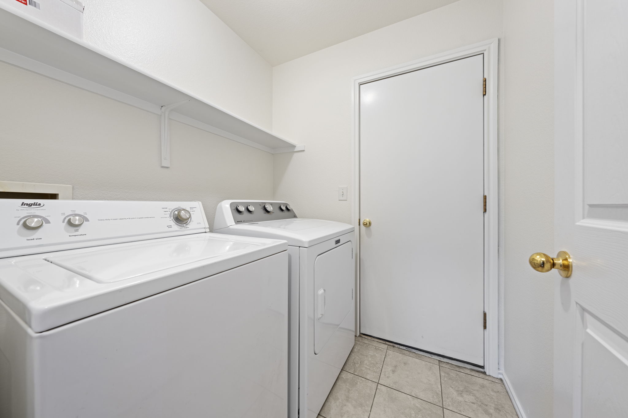 1011 Janae Court Georgetown, TX 78626 - Photo 22 of 26 a utility room with dryer and washer