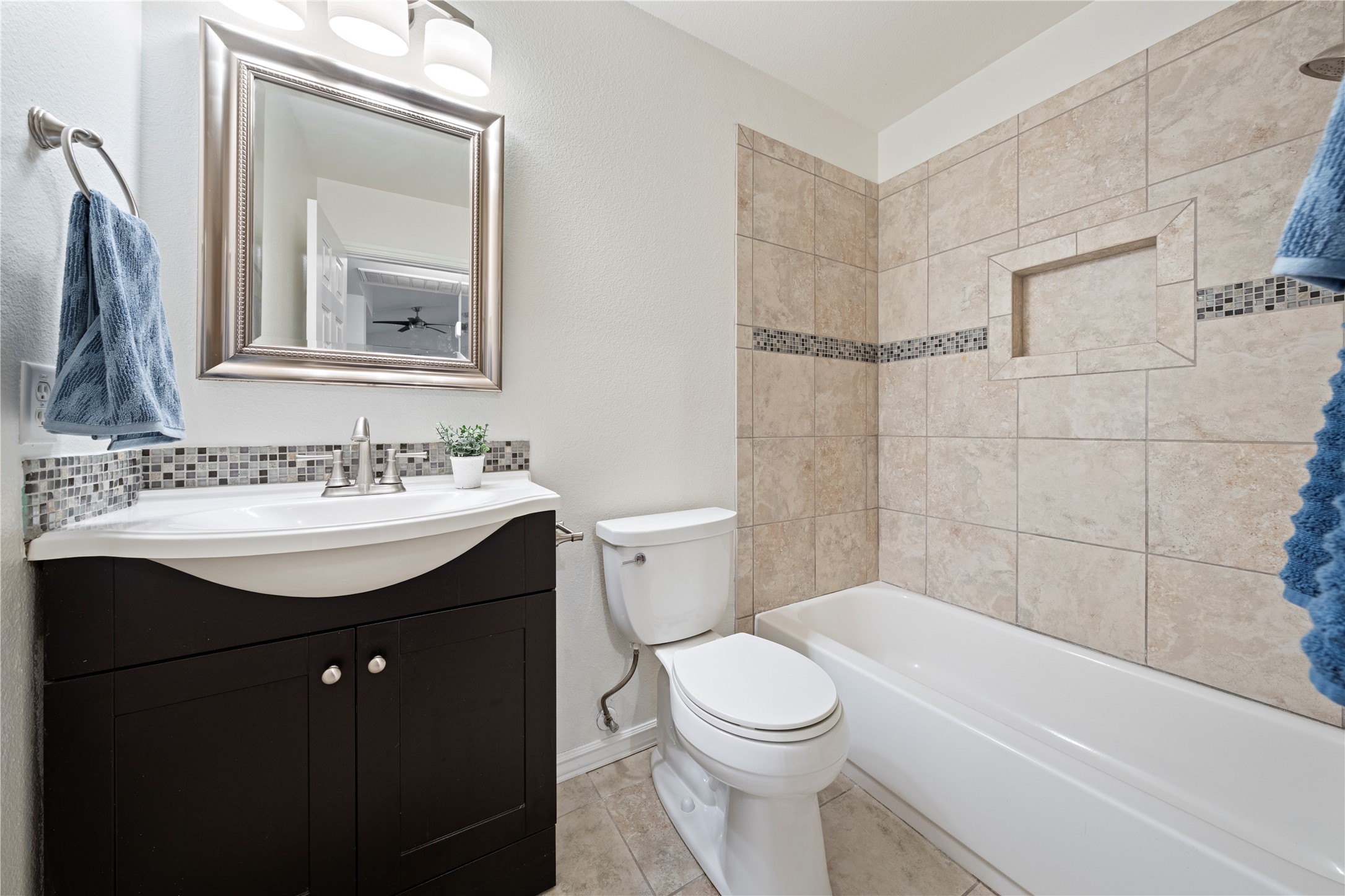 1011 Janae Court Georgetown, TX 78626 - Photo 4 of 26 a bathroom with a sink toilet and shower