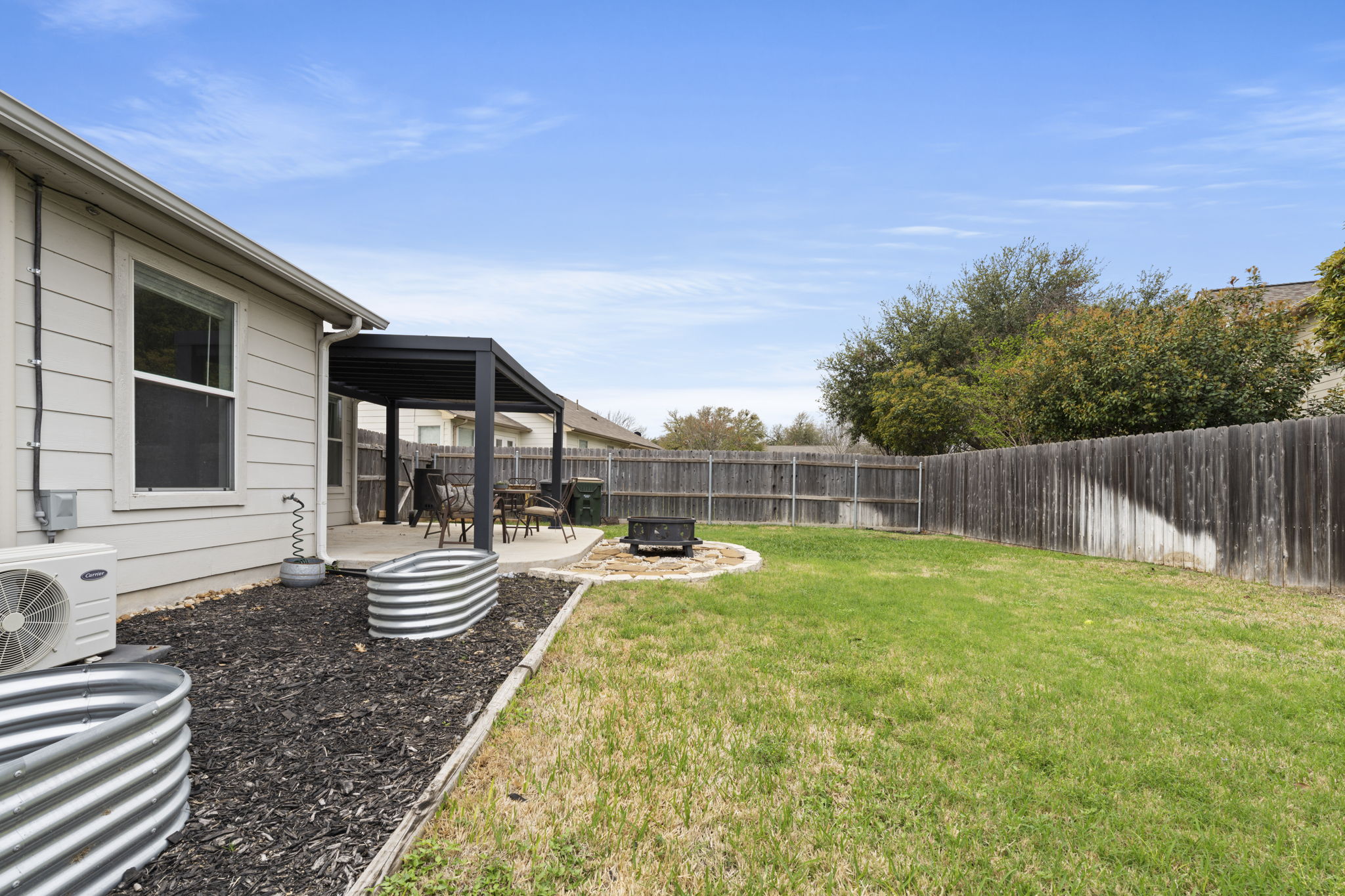 1011 Janae Court Georgetown, TX 78626 - Photo 7 of 26 a backyard of a house with table and chairs