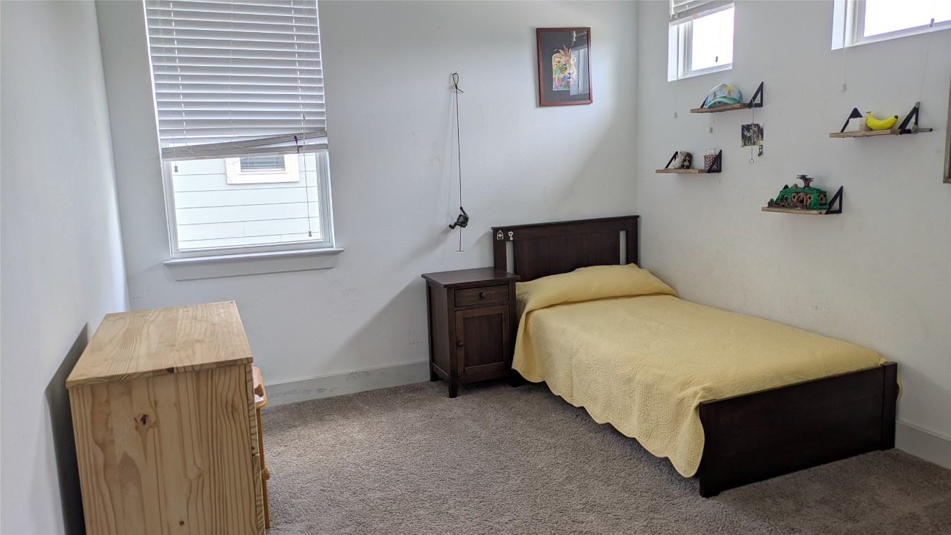 7113 Cherry Beam Path Austin, TX 78744 - Photo 14 of 24 Upstairs bedroom 2
