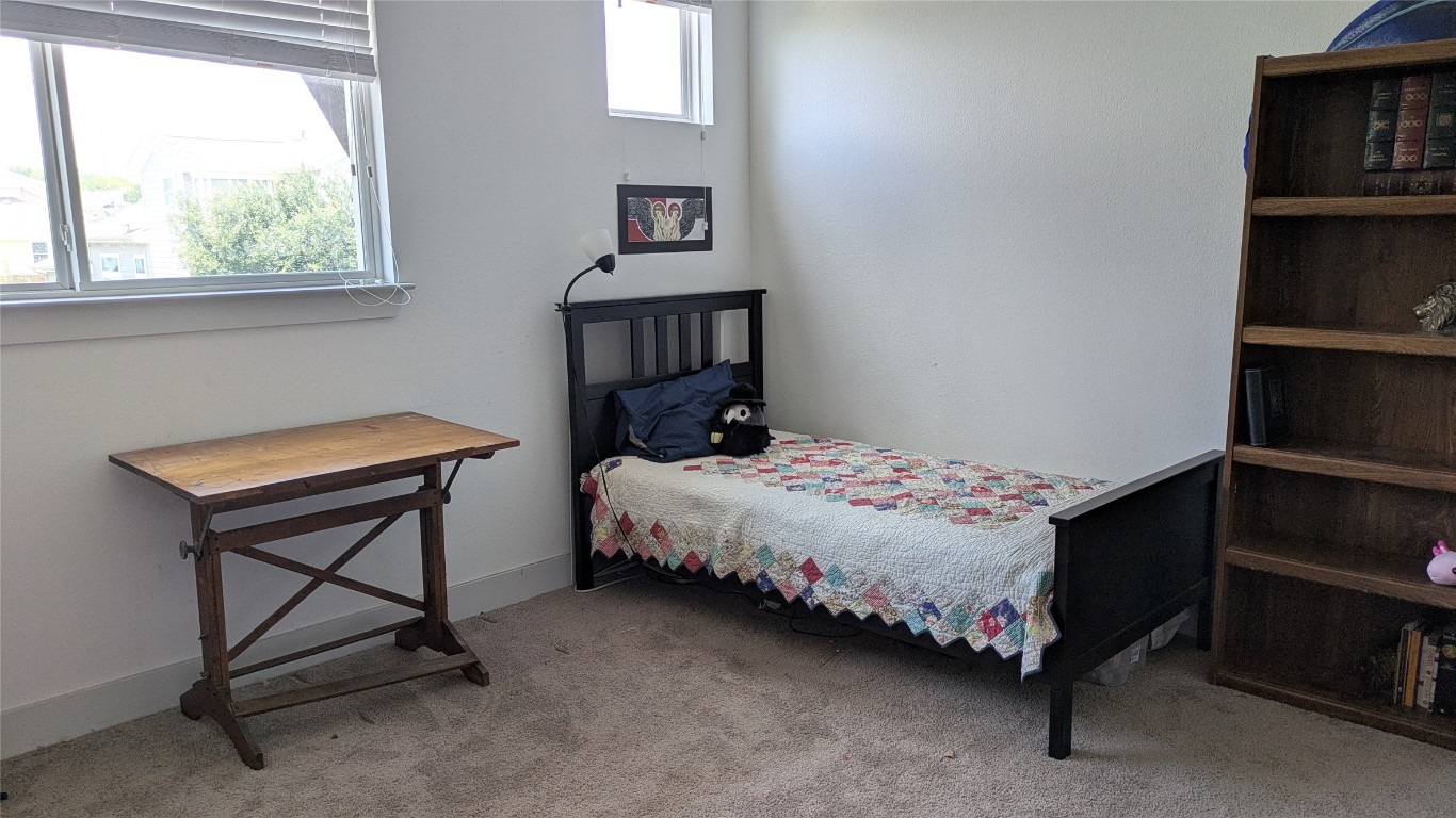 7113 Cherry Beam Path Austin, TX 78744 - Photo 15 of 24 Upstairs bedroom 3