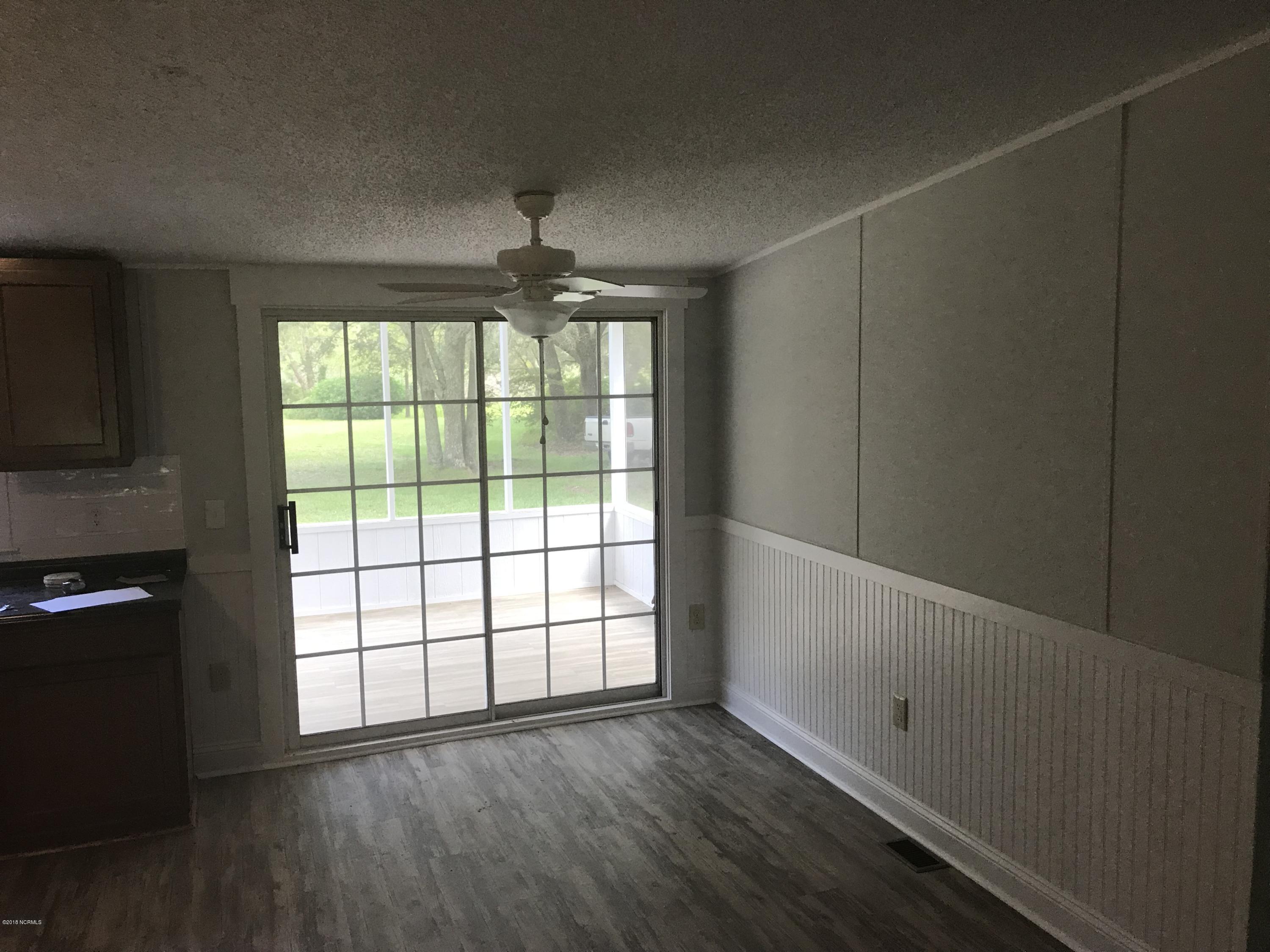200 Susans Drive Hampstead, NC 28443 - Photo 6 of 13 Dining Room/Access to Back Deck