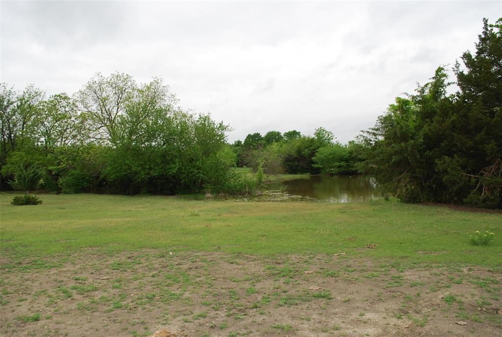 232 Terry Lane Heath, TX 75032 - Photo 4 of 4 a view of a lake with a yard