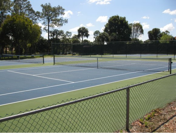 409 Gabriel Circle, Unit 7 Naples, FL 34104 - Photo 14 of 18 a view of a tennis court