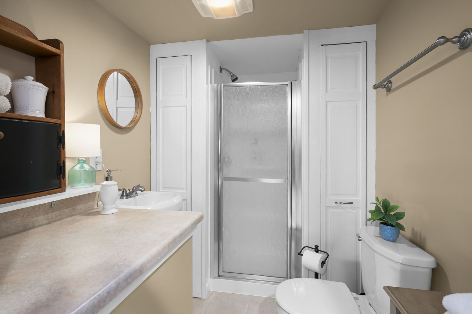 1565 Freeman Road Hoffman Estates, IL 60192 - Photo 37 of 46 a bathroom with a granite countertop toilet a sink and a mirror
