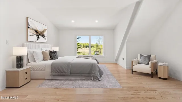 a spacious bedroom with a bed and a couch