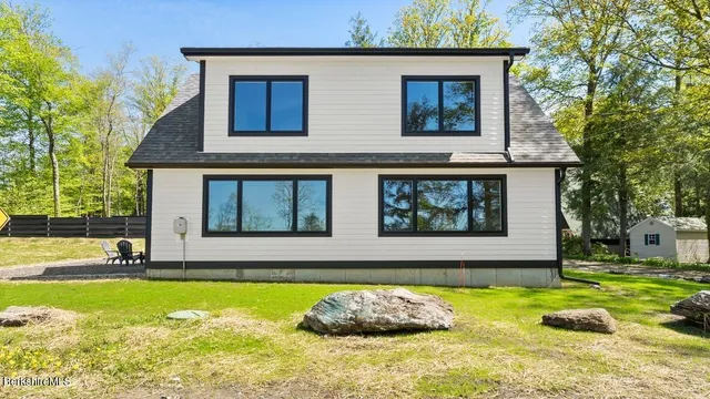 a front view of house with yard