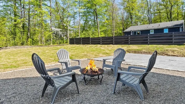 a view of a chairs and table in the outdoor sitting area