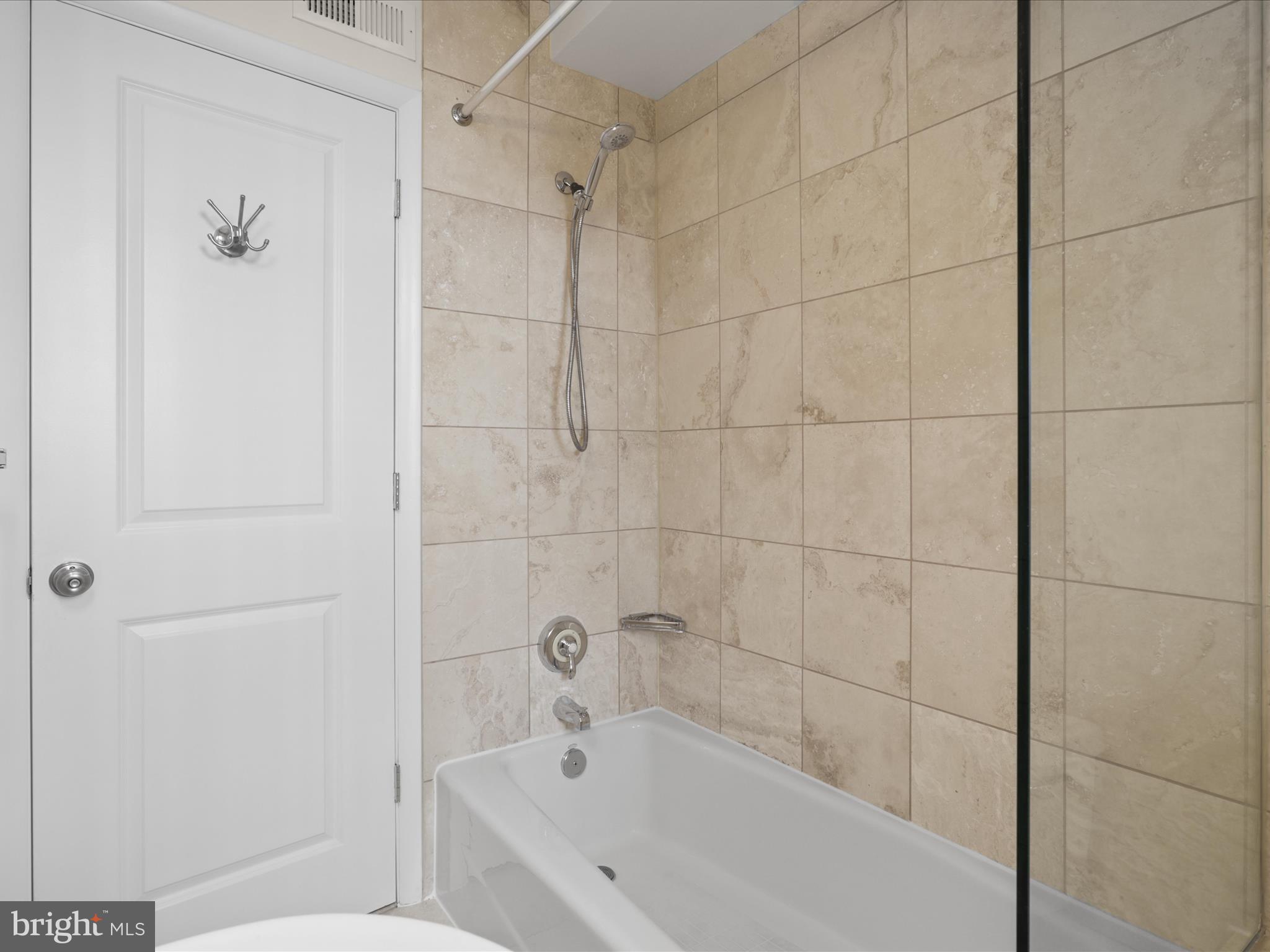 1858 California Street Northwest, Unit 33 Washington, DC 20009 - Photo 16 of 32 a bathroom with a bathtub and shower