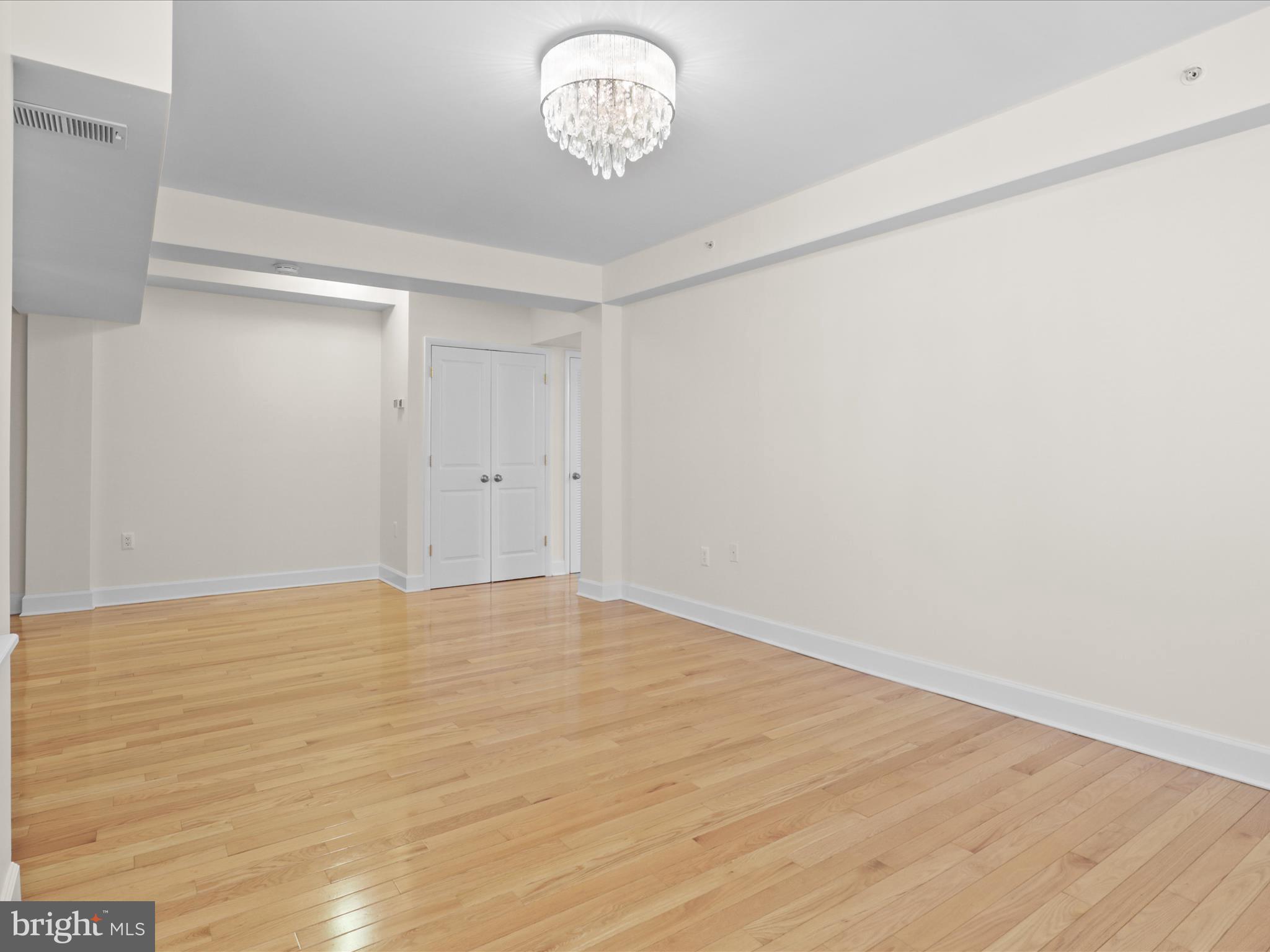 1858 California Street Northwest, Unit 33 Washington, DC 20009 - Photo 6 of 32 a view of an empty room with a window
