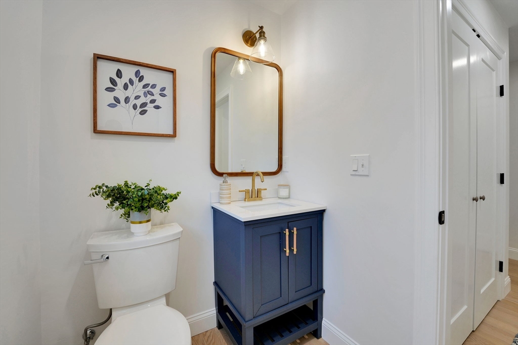 5 Rita's Way Fairhaven, MA 02719 - Photo 16 of 30 a bathroom with a toilet sink and mirror