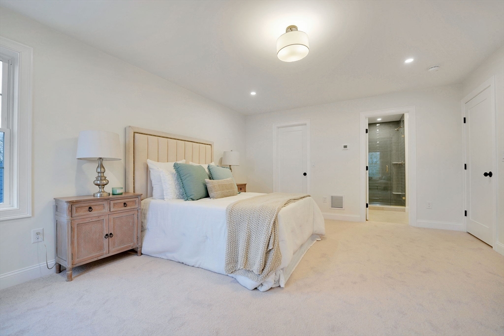 5 Rita's Way Fairhaven, MA 02719 - Photo 18 of 30 a spacious bedroom with a bed and a cabinets