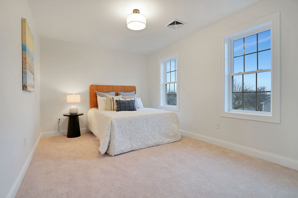 5 Rita's Way Fairhaven, MA 02719 - Photo 20 of 30 a bedroom with a bed and window