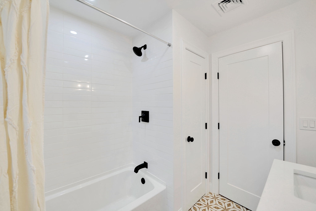 5 Rita's Way Fairhaven, MA 02719 - Photo 24 of 30 a bathroom with a bathtub and a shower