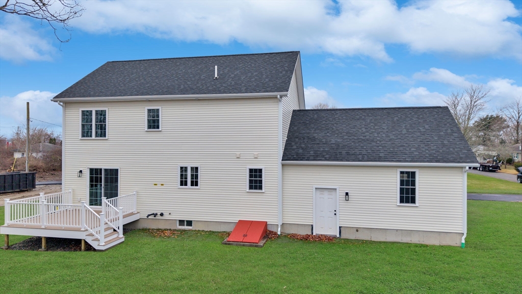 5 Rita's Way Fairhaven, MA 02719 - Photo 28 of 30 a aerial view of a house with a yard table and chairs