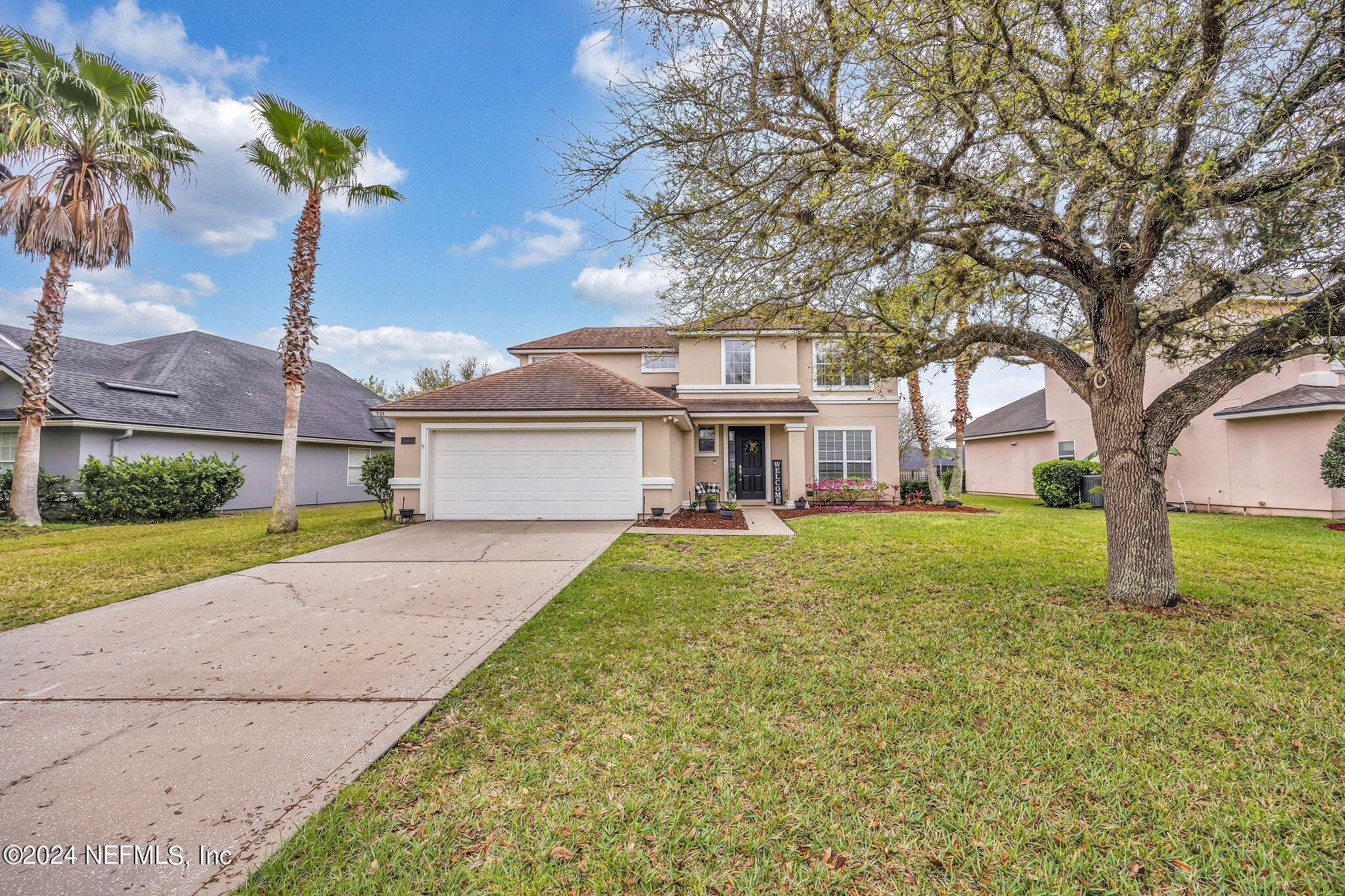 737 Porta Rosa Circle St. Augustine, FL 32092 - Photo 11 of 75 a front view of a house with garden