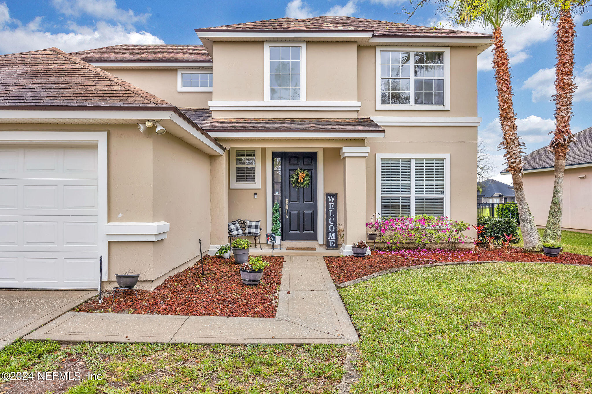 737 Porta Rosa Circle St. Augustine, FL 32092 - Photo 13 of 75 a front view of a house with a yard