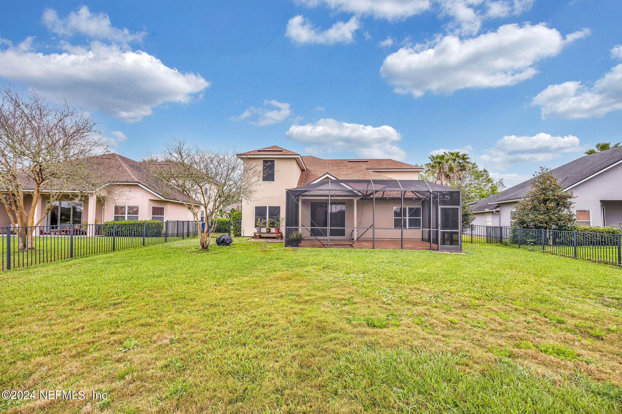 737 Porta Rosa Circle St. Augustine, FL 32092 - Photo 17 of 75 a view of a big house with a big yard and large trees