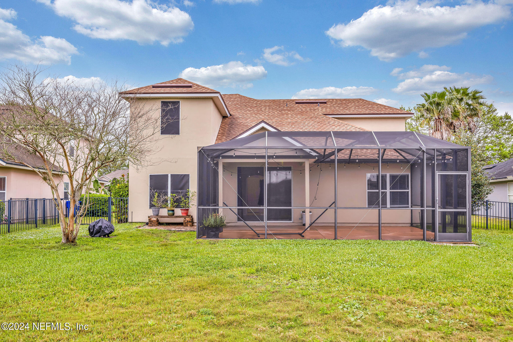 737 Porta Rosa Circle St. Augustine, FL 32092 - Photo 18 of 75 a front view of a house with a garden and plants
