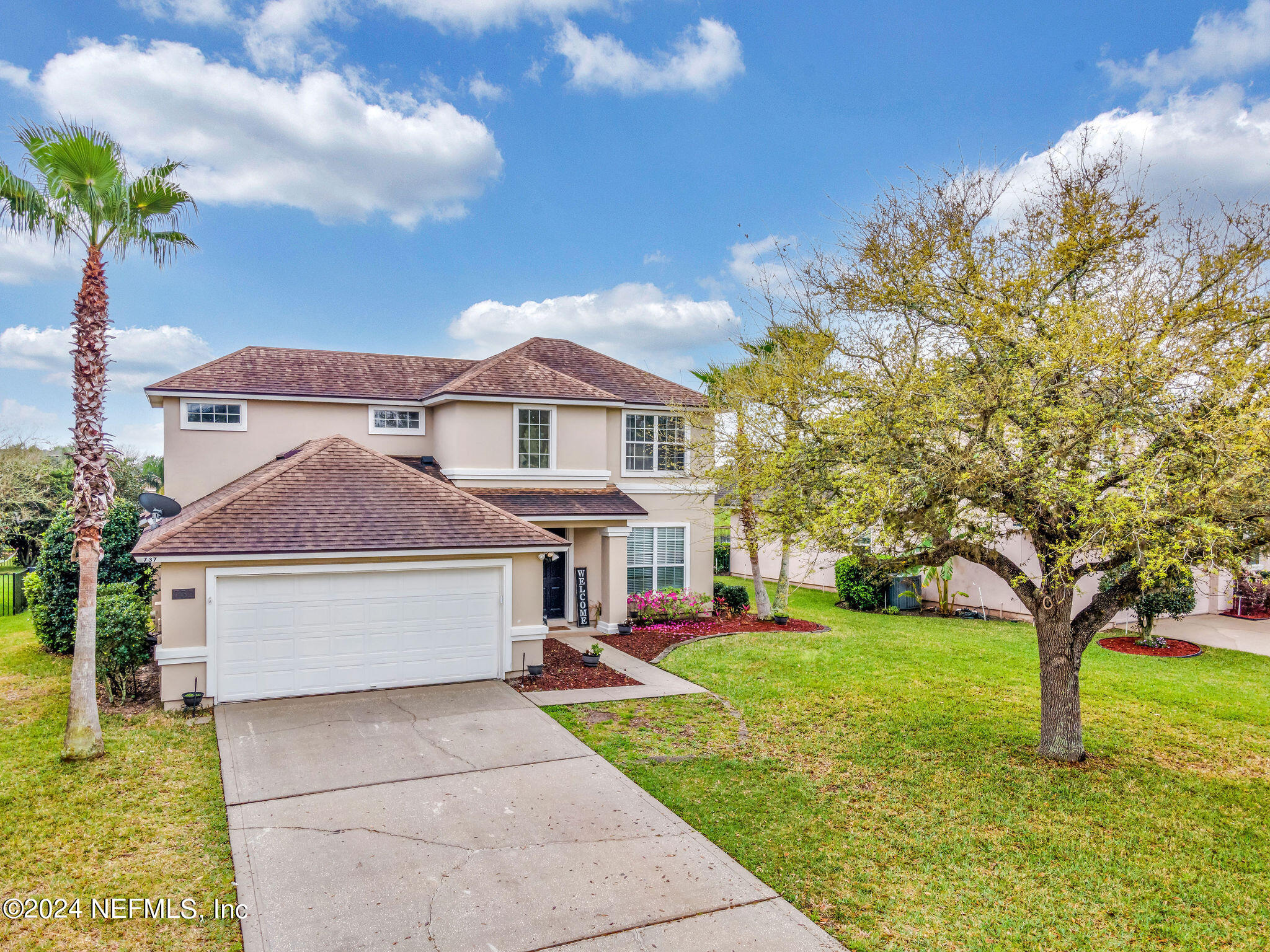 737 Porta Rosa Circle St. Augustine, FL 32092 - Photo 2 of 75 a front view of house with yard and green space