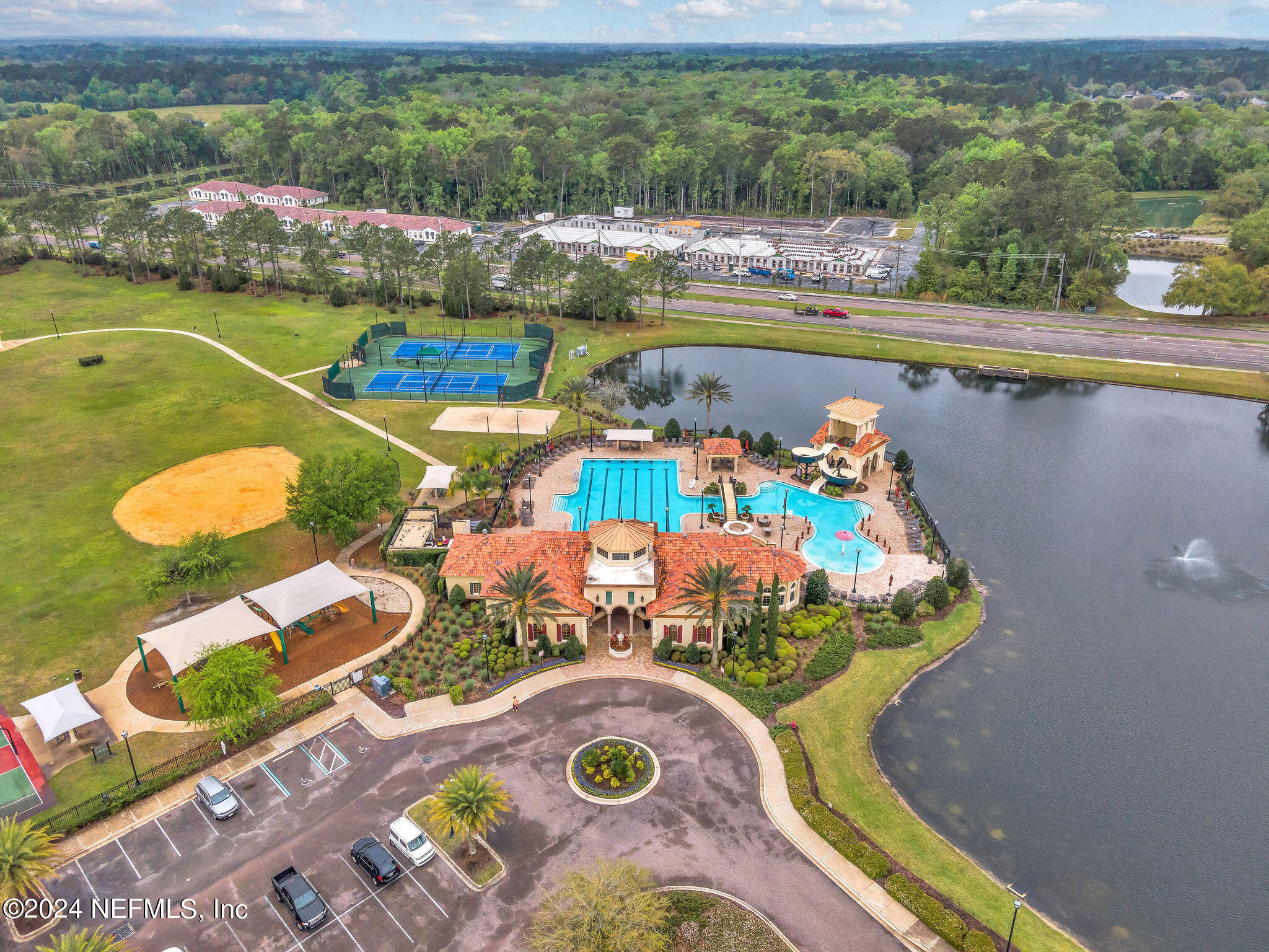 737 Porta Rosa Circle St. Augustine, FL 32092 - Photo 23 of 75 an aerial view of a house with swimming pool and tennis court