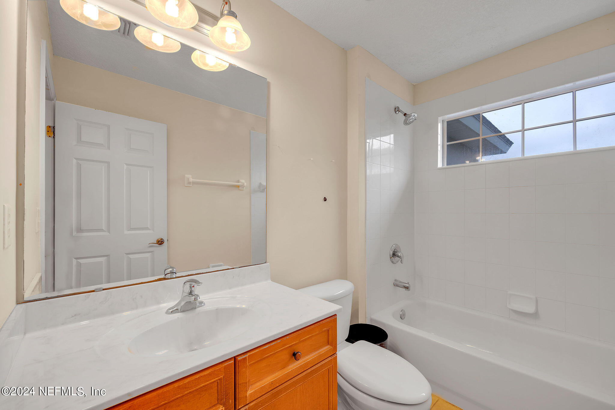 737 Porta Rosa Circle St. Augustine, FL 32092 - Photo 32 of 75 a bathroom with a sink a toilet and bathtub