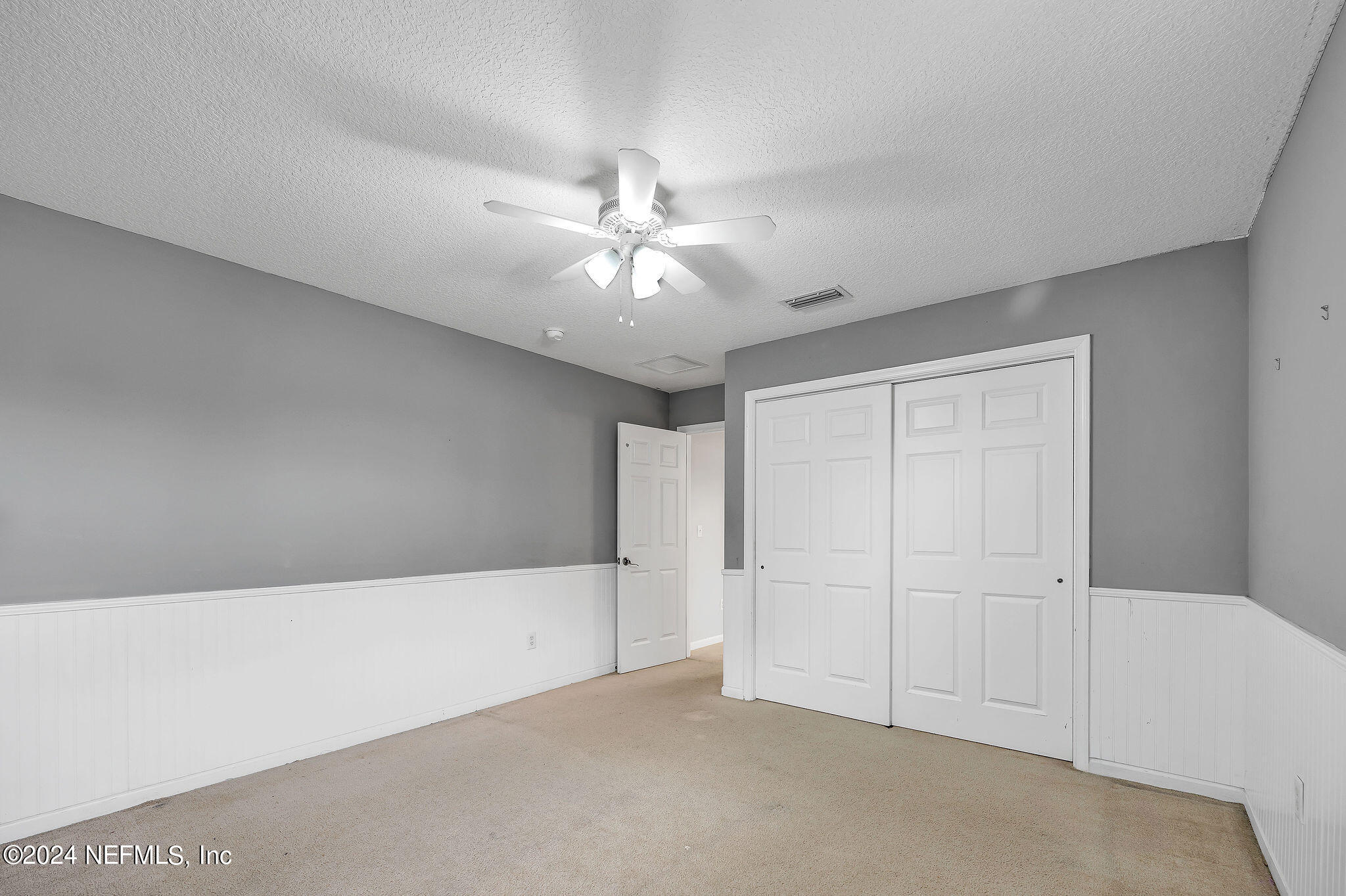 737 Porta Rosa Circle St. Augustine, FL 32092 - Photo 35 of 75 a view of an empty room with a ceiling fan