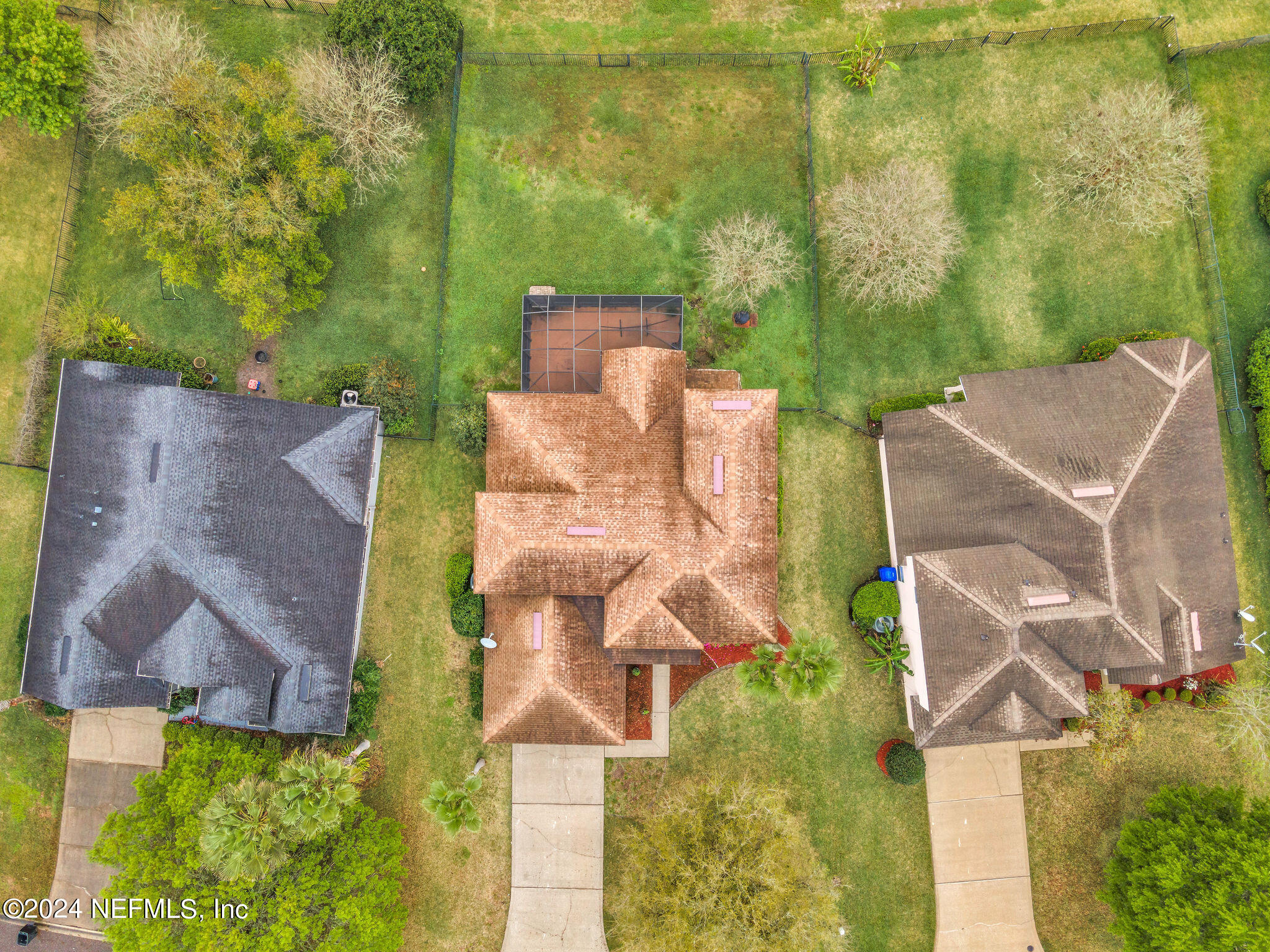 737 Porta Rosa Circle St. Augustine, FL 32092 - Photo 36 of 75 an aerial view of a house with a yard and trees