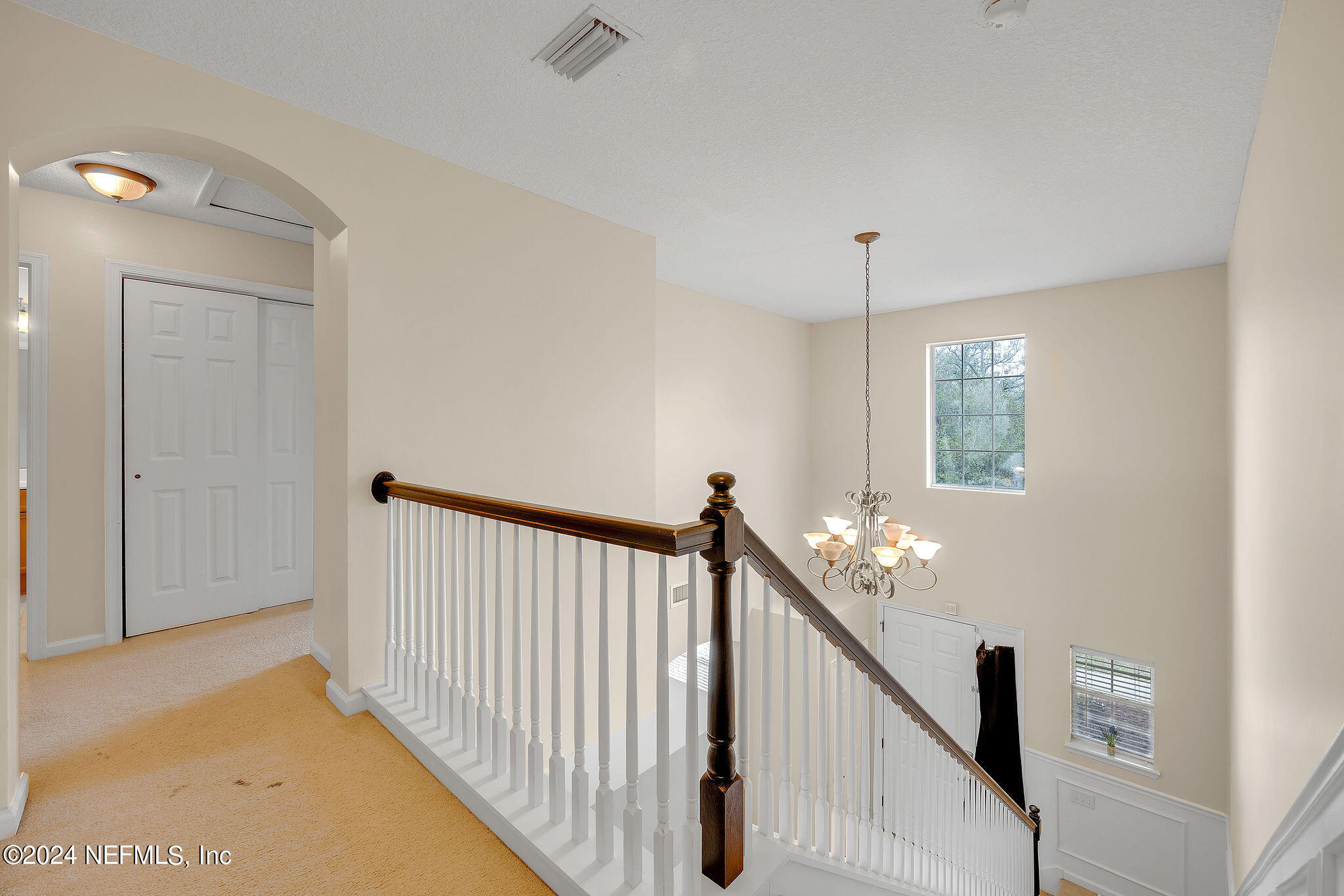 737 Porta Rosa Circle St. Augustine, FL 32092 - Photo 38 of 75 a view of a hallway with windows