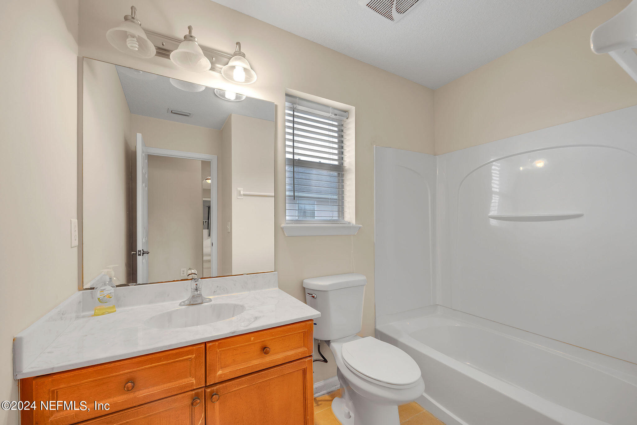 737 Porta Rosa Circle St. Augustine, FL 32092 - Photo 39 of 75 a bathroom with a sink a toilet and shower