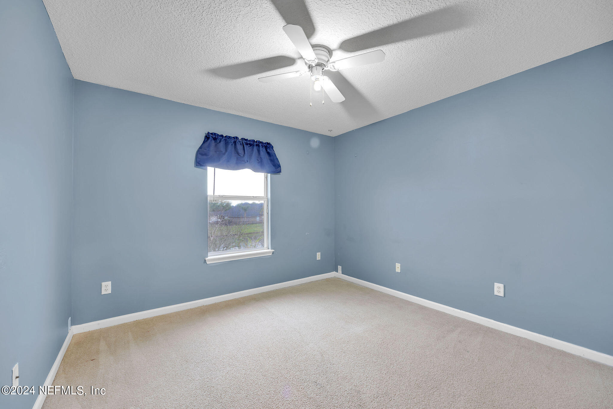737 Porta Rosa Circle St. Augustine, FL 32092 - Photo 45 of 75 an empty room with a window and a ceiling fan