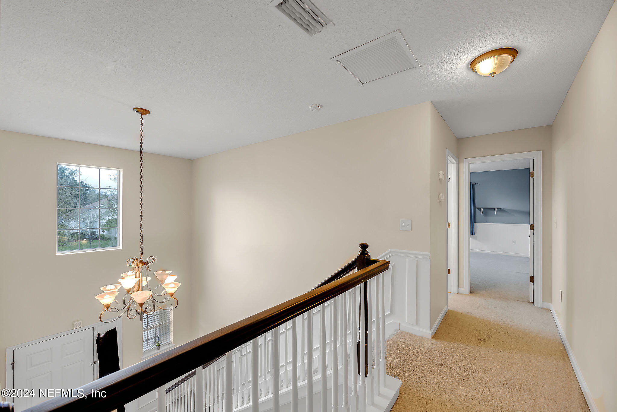 737 Porta Rosa Circle St. Augustine, FL 32092 - Photo 47 of 75 a view of a chandelier in hallway with windows and chandelier