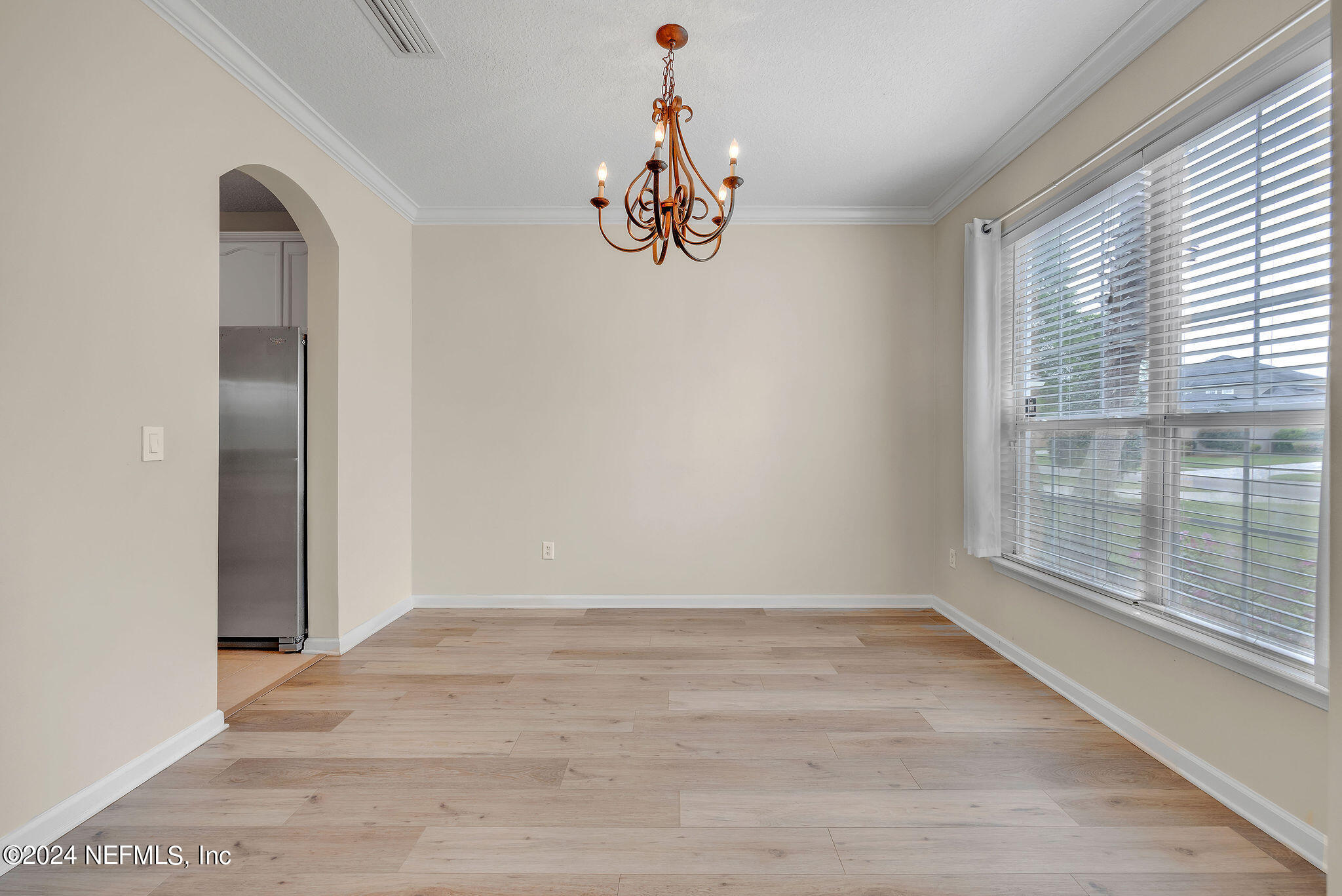 737 Porta Rosa Circle St. Augustine, FL 32092 - Photo 51 of 75 a view of an empty room with window wooden floor and front door