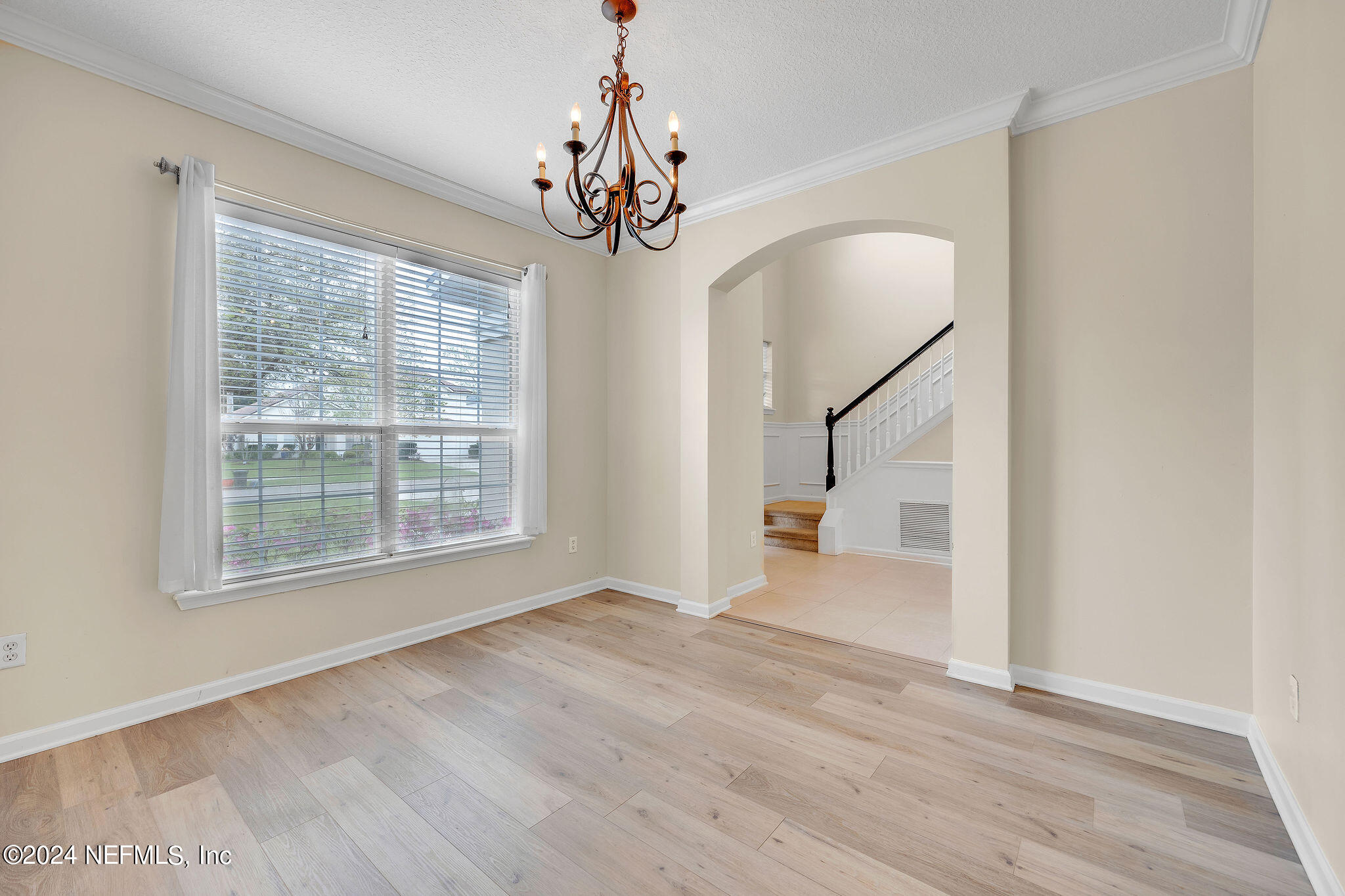 737 Porta Rosa Circle St. Augustine, FL 32092 - Photo 54 of 75 a view of an empty room with wooden floor and a window