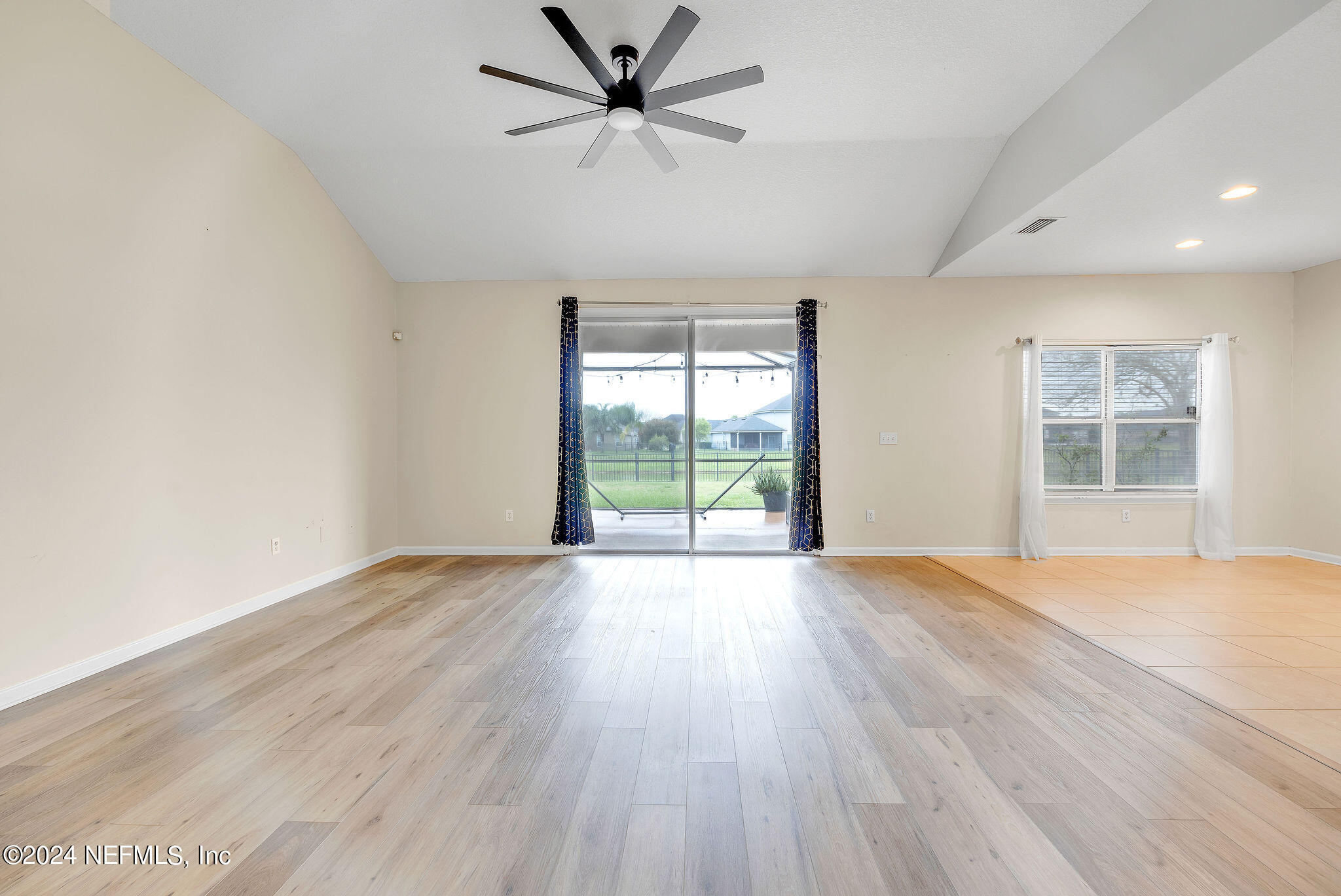 737 Porta Rosa Circle St. Augustine, FL 32092 - Photo 57 of 75 an empty room with wooden floor fan and windows