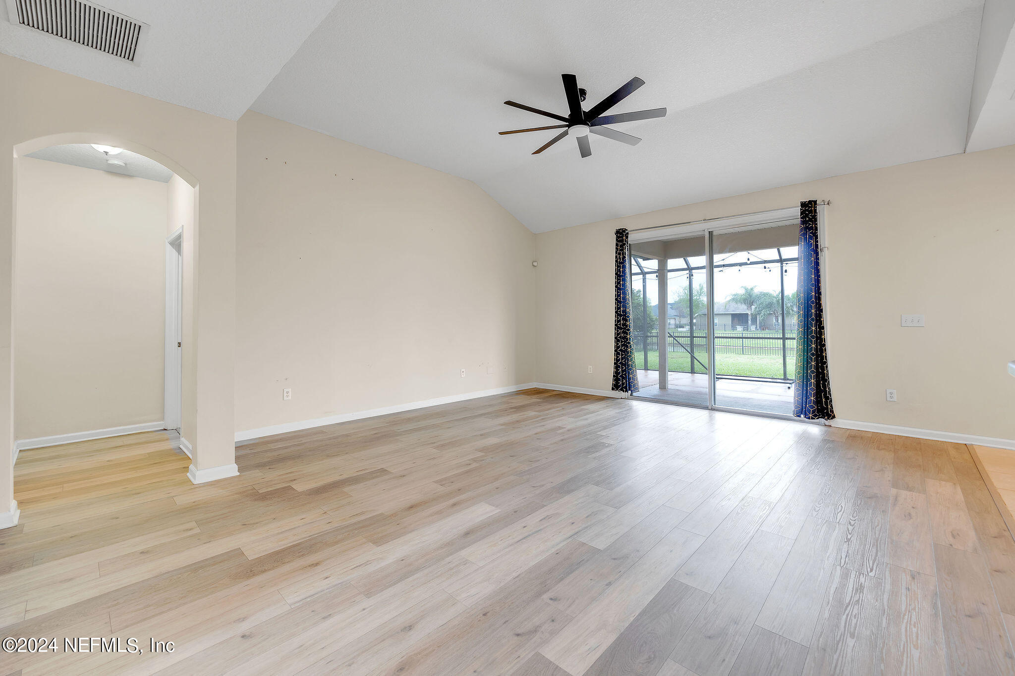 737 Porta Rosa Circle St. Augustine, FL 32092 - Photo 58 of 75 an empty room with wooden floor and windows