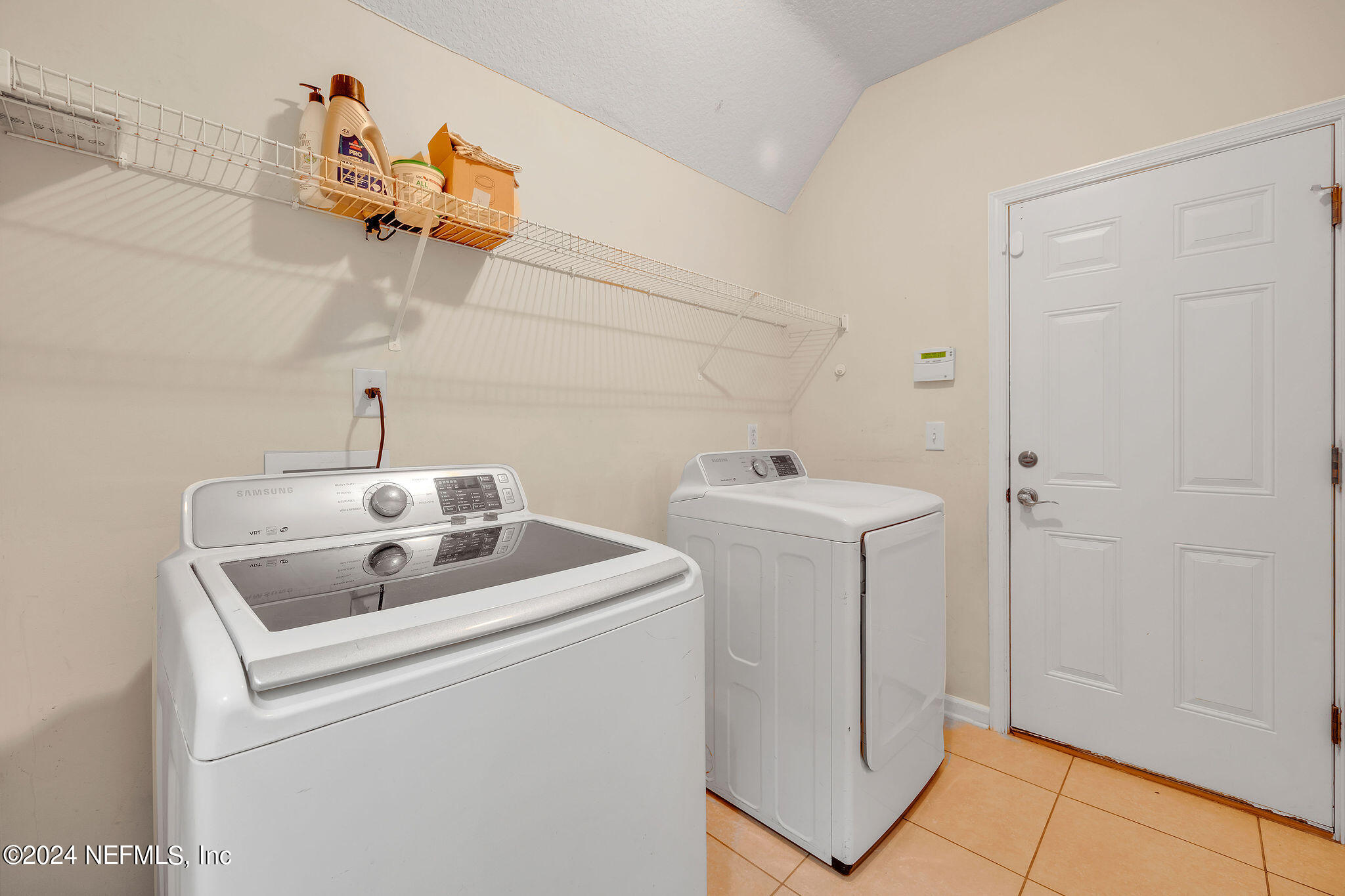 737 Porta Rosa Circle St. Augustine, FL 32092 - Photo 59 of 75 a utility room with dryer and washer