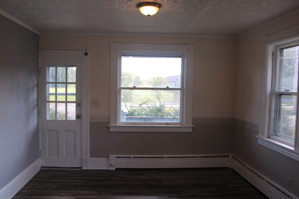 7 State Road Whately, MA 01373 - Photo 14 of 31 an empty room with wooden floor and windows