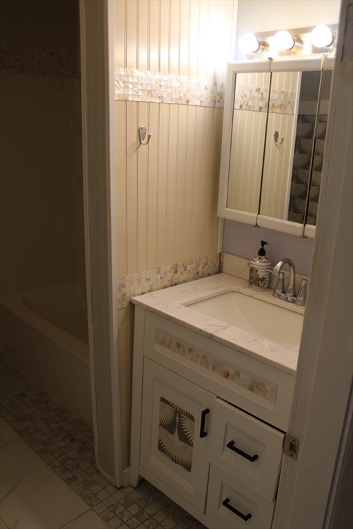 7 State Road Whately, MA 01373 - Photo 21 of 31 a bathroom with a granite countertop sink and a mirror