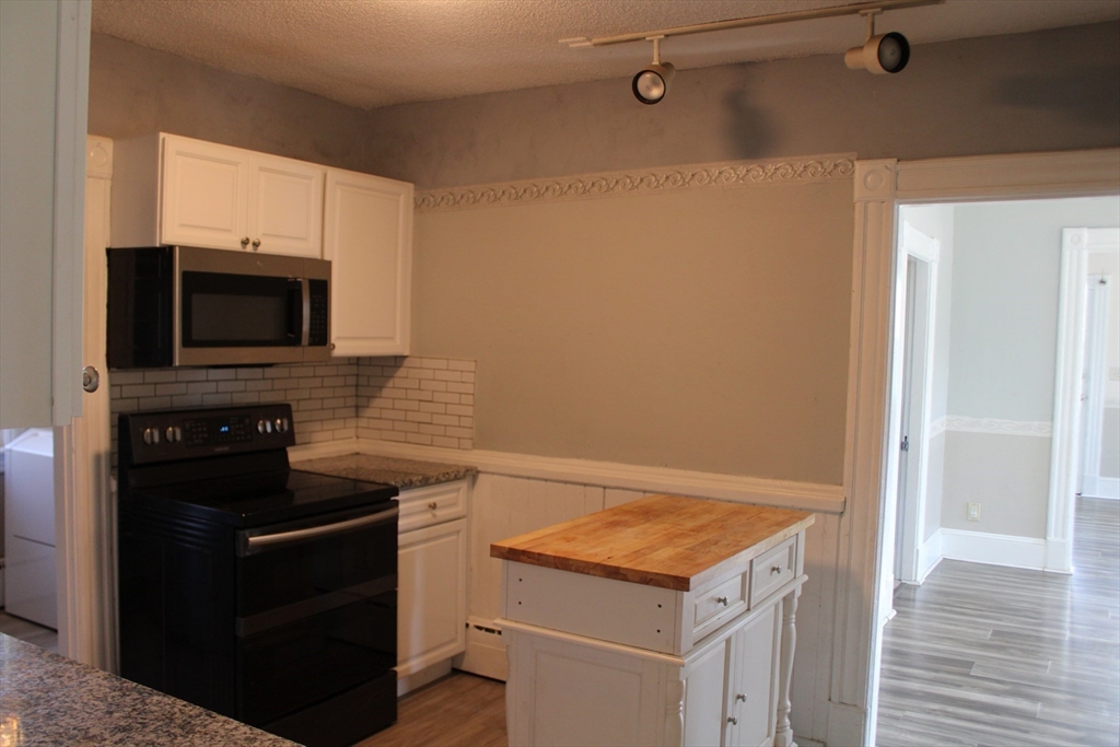 7 State Road Whately, MA 01373 - Photo 10 of 31 a kitchen with a stove and a microwave